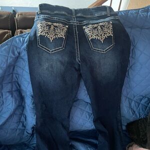 two pairs of boot cut jeans